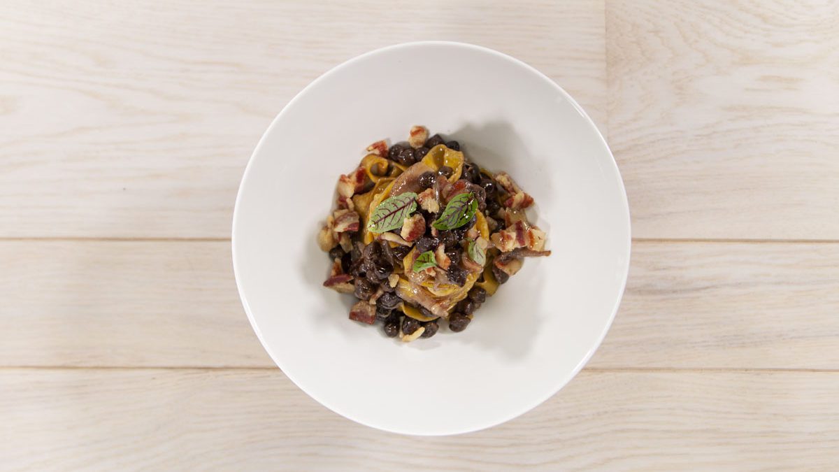 Tagliatelle with bacon, black chickpeas, and shallot
